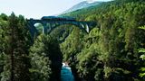 Train crossing Kylling Bridge on the Rauma Line, Romsdalen, Norway
