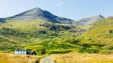 An isolated house beneath Ben More on the Isle of Mull, Scotland, UK