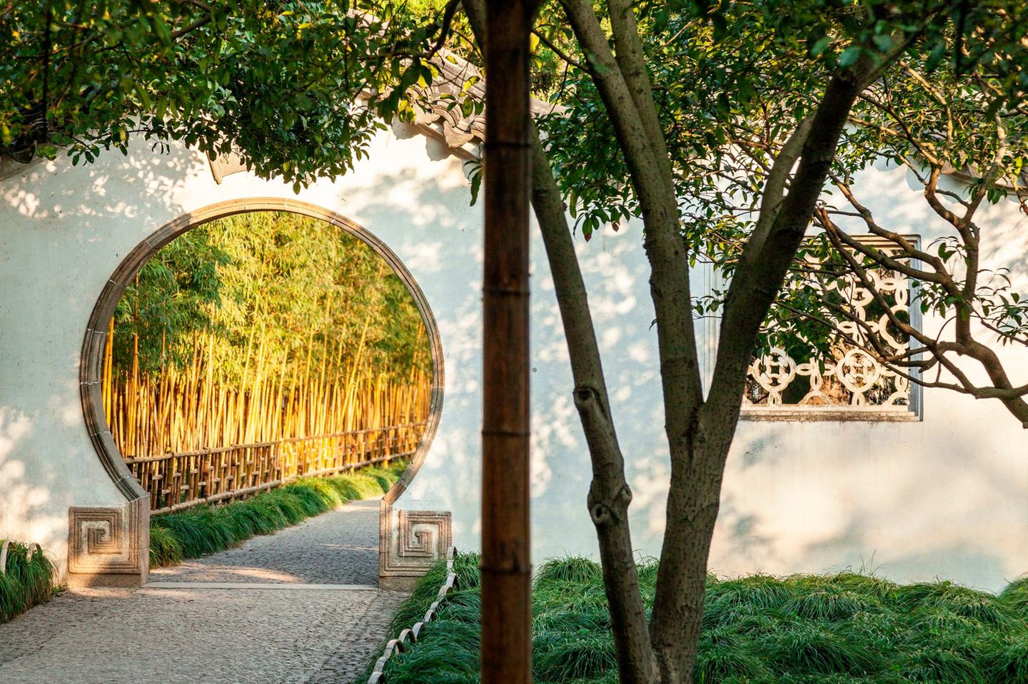 Opening called "Moon Gate" in a wall of a classical garden in Suzhou, China