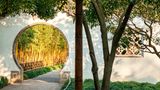 Opening called "Moon Gate" in a wall of a classical garden in Suzhou, China