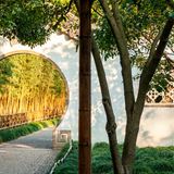 Opening called "Moon Gate" in a wall of a classical garden in Suzhou, China