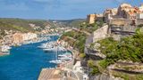 Bonifacio, the citadel and the port with many moored boats. Corse-du-Sud, Corsica, France