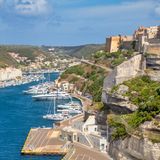 Bonifacio, the citadel and the port with many moored boats. Corse-du-Sud, Corsica, France