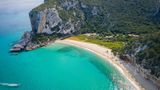 Aerial view of the amazing beach of Cala Luna and the mouth of the river Codula di Luna,Orosei gulf,Nuoro district,Ogliastra,Sardinia,Italy.