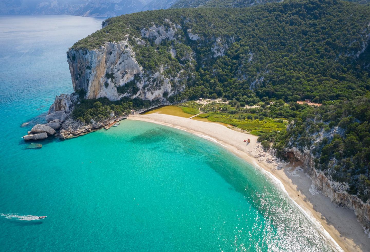 Aerial view of the amazing beach of Cala Luna and the mouth of the river Codula di Luna,Orosei gulf,Nuoro district,Ogliastra,Sardinia,Italy.