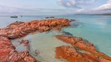 Red rock cliffs on Palombaggia beach. Porto Vecchio, Southern Corsica, France