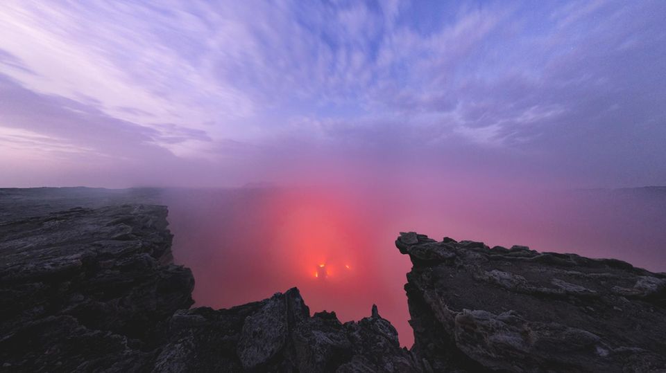 East African Rift: Sunrise over fumarole and and lava lake inside the Erta Ale volcano caldera at dusk, Danakil Depression, Afar Region, Ethiopia, Africa Sunrise over fumarole and and lava lake inside the Erta Ale volcano caldera at dusk, Danakil Depression, Afar Region, Ethiopia, Africa