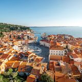 Beautiful aerial view on Piran town with Tartini main square, ancient buildings with red roofs and Adriatic sea in southwestern Slovenia