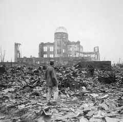 The wrecked framework of the Museum of Science and Industry in Hiroshima as it appeared shortly after the blast. City officials recently decided to preserve this building as a memorial though they had at first planned to rebuild it.