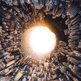 Open Runner Up _plus_Special Awards_Vertical     Open runner-up  First place Built Environment category  Highest Scoring Aerial Image  Highest Scoring Vertical Image  Vitaly Golovatyuk, China  Vitaly Golovatyuk, known professionally as Panvelvet, is a Russian-born creative photographer and cinematographer based in Shanghai. His journey into photography began in 2012, sparked by the rise of social media and a desire to capture stills during his video assignments.Whether working with landscape, architecture, or travel, Vitaly infuses his work with a distinctive creative vision, consistently pushing the boundaries of the medium. This approach has earned him numerous international awards. For Vitaly, photography is more than a profession-it is an essential outlet for creating timeless art.  panvelvet.com  IG @panvelvet    This aerial photograph was captured from Victoria Peak, Hong Kong, at sunset. As a technical experiment, I manually shot a 48-image panorama using a DJI Phantom 3 Pro.  The final artwork is the result of meticulously stitching and inverting the composite, transforming the city and sky into a mesmerizing, abstract landscape.  Upon its initial release, the image captivated a global audience, overwhelming my Instagram with an unexpected and passionate response.   