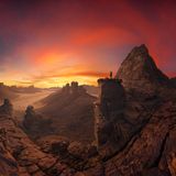 Open Photographer of the  Year and the Nature/Landscape category is Alessandro Cantarelli from Italy for  his entries Last Fireworks, Jackpot and Mann.     Last Fireworks  Describing Last Fireworks Cantarelli said, “As the sun went down, the sky literally  exploded. Layer after layer of clouds lit up, painting the desert with fire and gold.  Using my Sony A7 IV with a fisheye lens on a tripod, I captured a full multi-  exposure sequence at f/8 and ISO 100, rotating carefully around the nodal point  to create a seamless 360° panorama.”