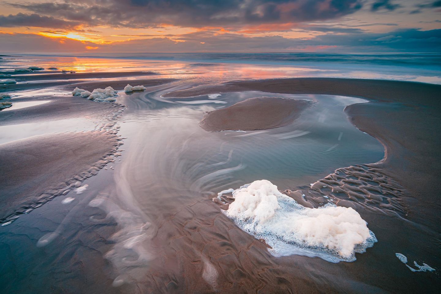 Sunset over beach at North sea coast,GR Noordwijk,Netherlands