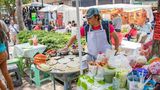 Mexico City, Mexico, Woman preparing Mexican food in a weekend market on a Saturday in  Alameda Central Park.