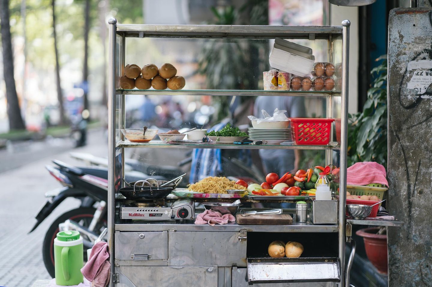 HO CHI MINH, VIETNAM,Detail of the ingredient for Vietnamese bread (Banh mi) Vietnamese baguette and fried noocle food stall beside the street. 