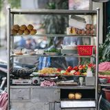 HO CHI MINH, VIETNAM,Detail of the ingredient for Vietnamese bread (Banh mi) Vietnamese baguette and fried noocle food stall beside the street. 