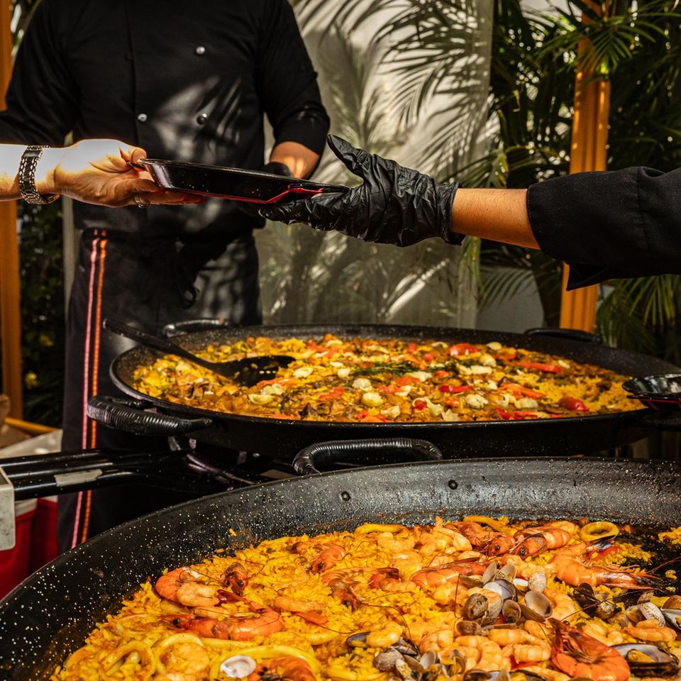 Chef cooking a seafood paella, Lima