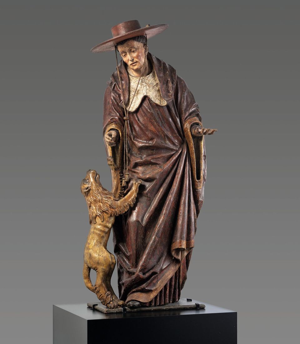 Ein Kardinal mit einem Löwen