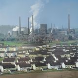 Eine Zeche mit davorliegenden Wohnhäusern
