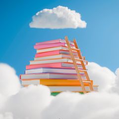 Eine Leiter führt im Traum auf einem Bücherstapel nach oben