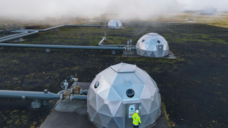 Caption/Abstract=Carbfix domes are seen at the Hellisheidi power plant near Reykjavik on October 11, 2021. At the base of an Icelandic volcano, the newly-opened plant is sucking carbon dioxide from the air and turning it to rock, locking away the main culprit behind global warming. (Photo by Halldor KOLBEINS / AFP)